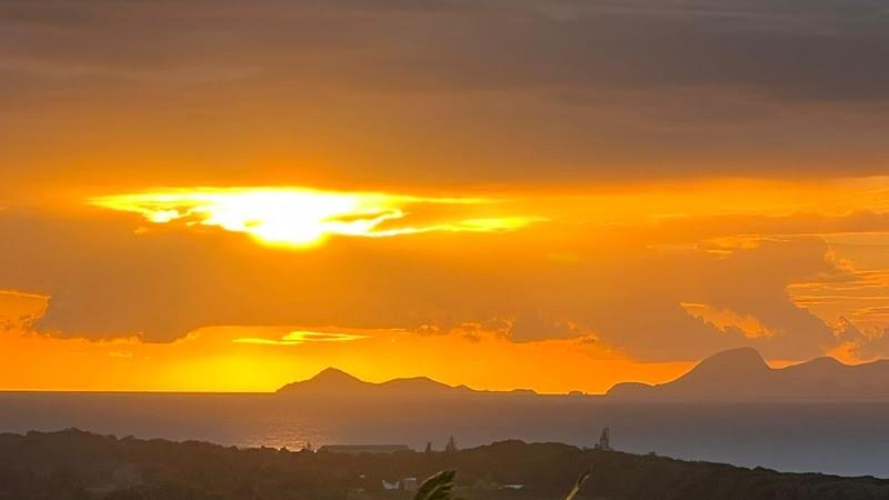 Sunset on Les Saintes photo copyright Grand Large Yachting taken at  and featuring the Cruising Yacht class