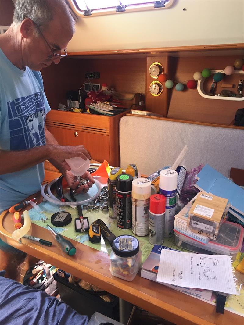 Always jobs to do even on a day off sailing due to high winds - Phil fault finding our day tank fuel pump - photo © SV Red Roo