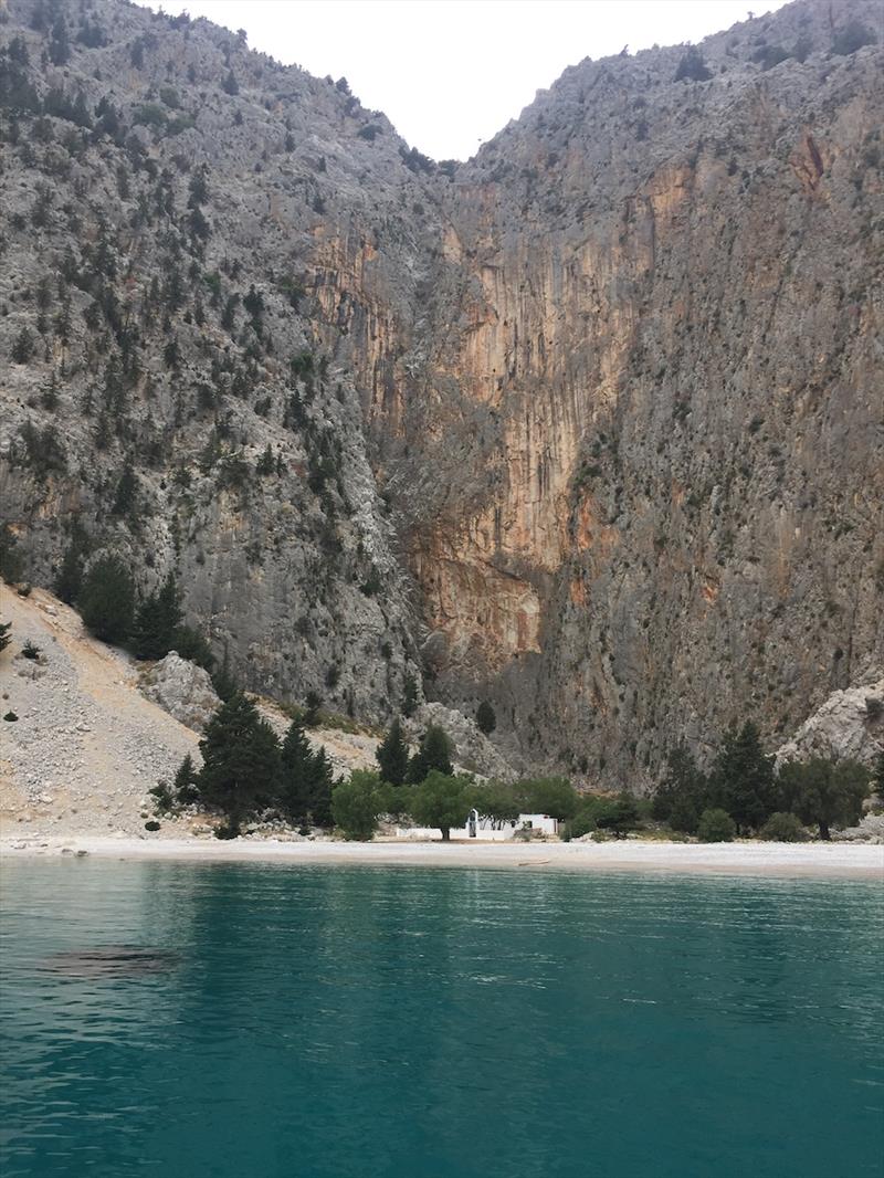 First night back in Greece, anchored on the island of Symi at Agios Georgios under the huge rock cliffs - photo © SV Red Roo