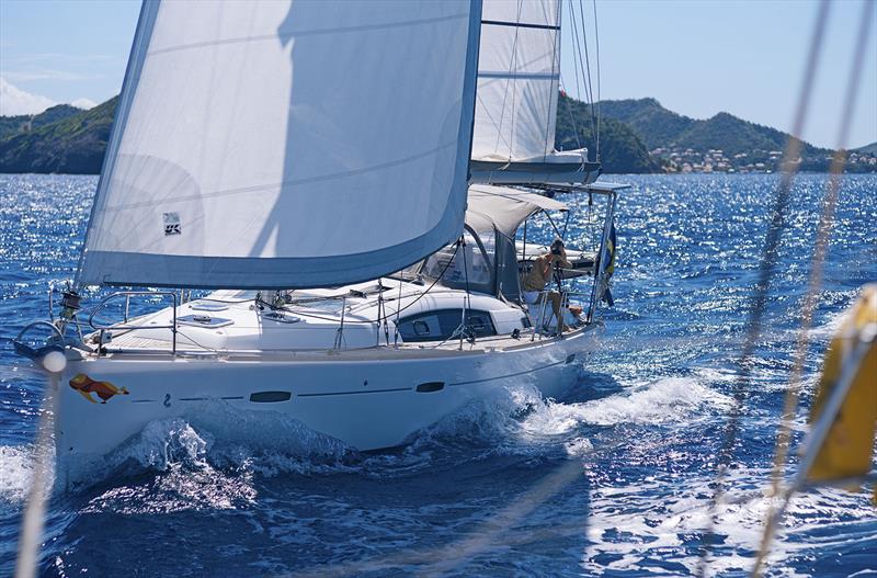 Polar Seal under sail, and you can see Sophie never misses a chance for good footage photo copyright 59 North Sailing taken at  and featuring the Cruising Yacht class