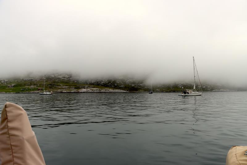Unusually, we had lots of fog during our time in Scotland. At anchor off Taransay with the fog just beginning to lift. Infinity B to the right - photo © Reg Barker