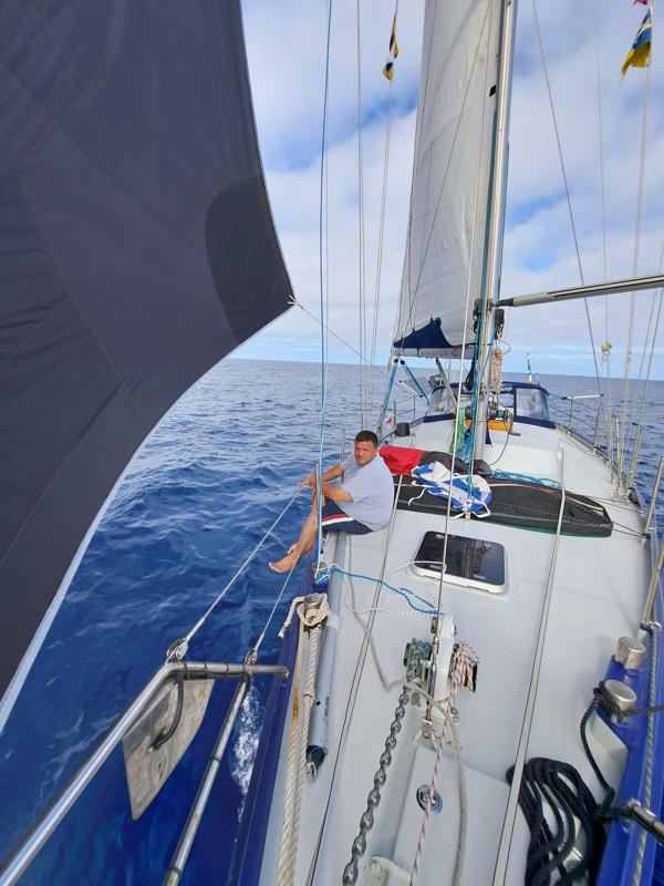 Spinnaker in light winds with the crew on deck relaxing photo copyright Rhys Walters taken at  and featuring the Cruising Yacht class