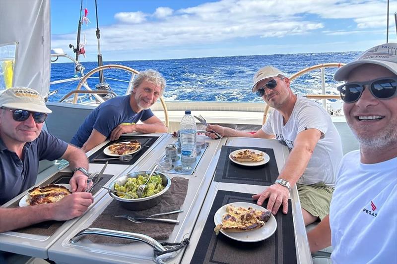 Pegasus 50 Sine Finis crew enjoying a meal photo copyright Pegasus Yachts taken at  and featuring the Cruising Yacht class