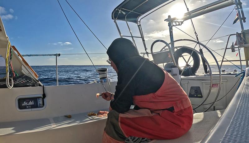 Eating sashimi in the cockpit - Blue Moon II circumnavigation photo copyright Tristan Gourlay taken at Tamar Yacht Club and featuring the Cruising Yacht class