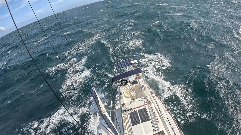 Climbing the mast to retrieve the main halyard - Blue Moon II circumnavigation photo copyright Tristan Gourlay taken at Tamar Yacht Club and featuring the Cruising Yacht class