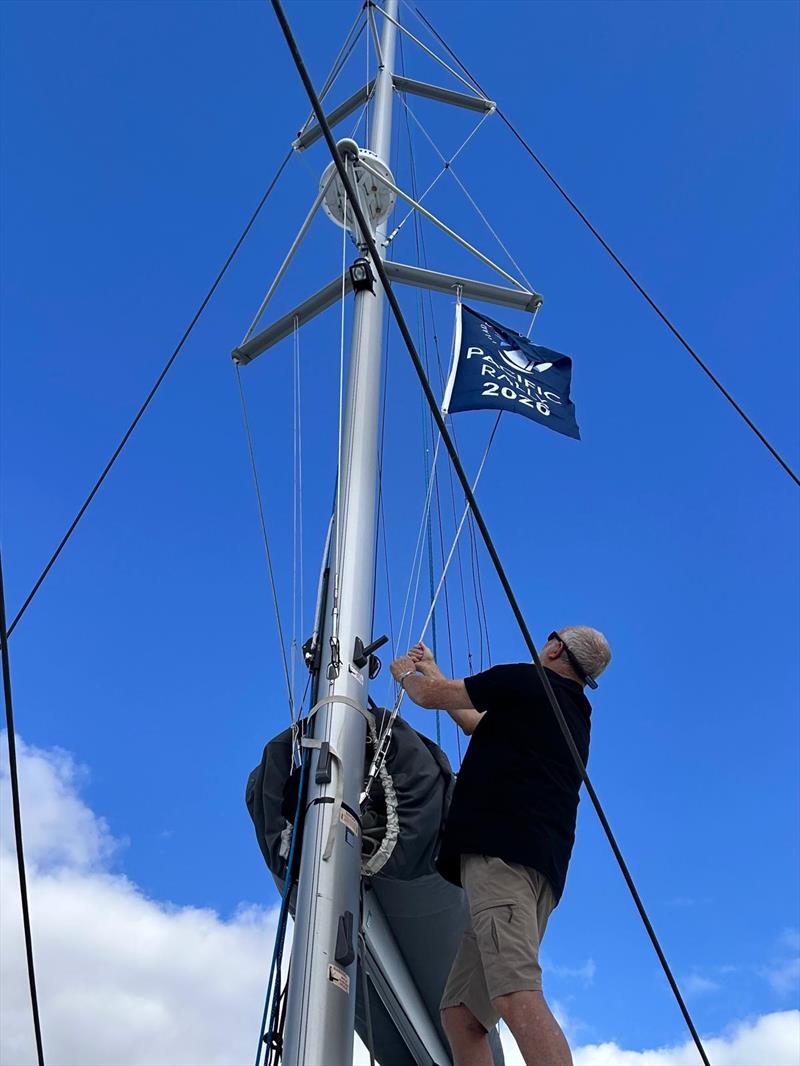 Island Cruising Pacific Rally Sets Sail - Roger from Aroha raises the Pacific Rally flag photo copyright Island Cruising NZ taken at  and featuring the Cruising Yacht class
