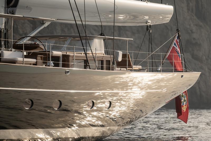 Aquarius at anchor - the black topsides are relieved by a silver cove stripe to complement the grey-painted rondal rig - photo © Royal Huisman