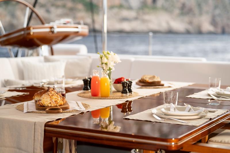 Aquarius II at anchor - The main cockpit tables can be raised and expanded - photo © Royal Huisman