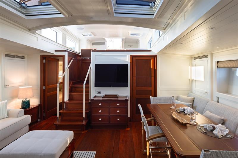 Ouzel, a 95ft superyacht - Ouzel's main saloon combines dining and lounge areas beneath a series of overhead skylights photo copyright Russell Kaye taken at  and featuring the Cruising Yacht class