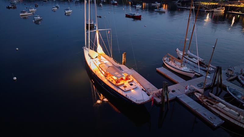 An aerial view captures Ouzel alongside the dock after sunset in Rockport Harbor photo copyright Russell Kaye taken at  and featuring the Cruising Yacht class