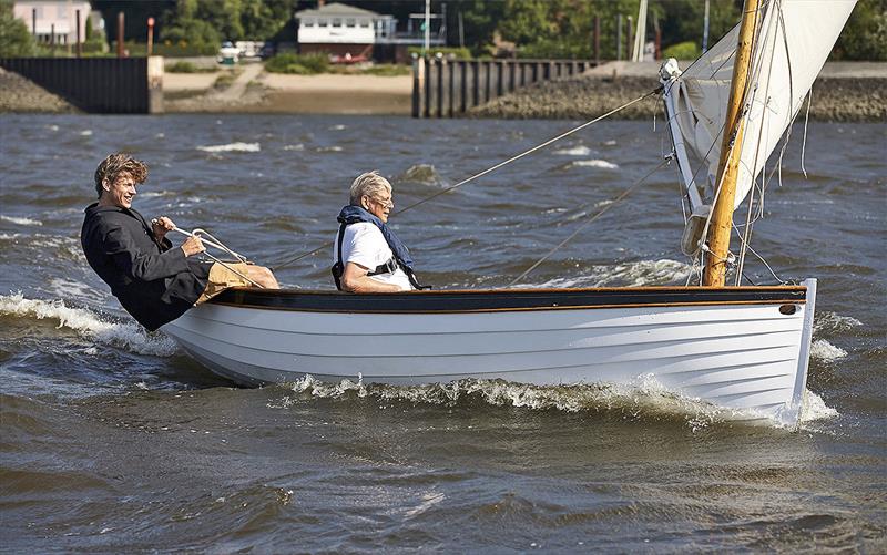 Hinnerk and his late father enjoying the new, smaller boat they built in the lounge room. - photo © Nico Krauss