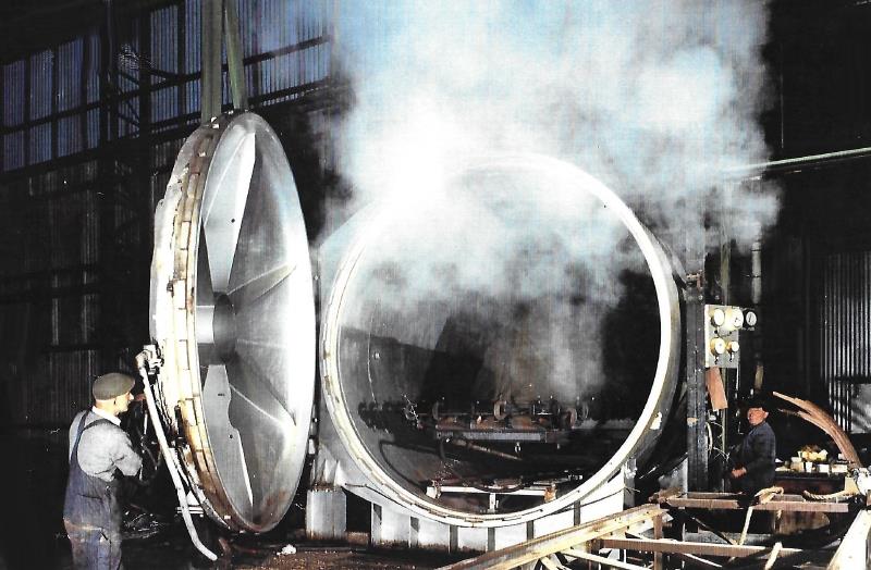 Opening up the autoclave with the steamed wooden structure inside, sheathed in rubber photo copyright G Currey taken at  and featuring the Classic & Vintage Dinghy class