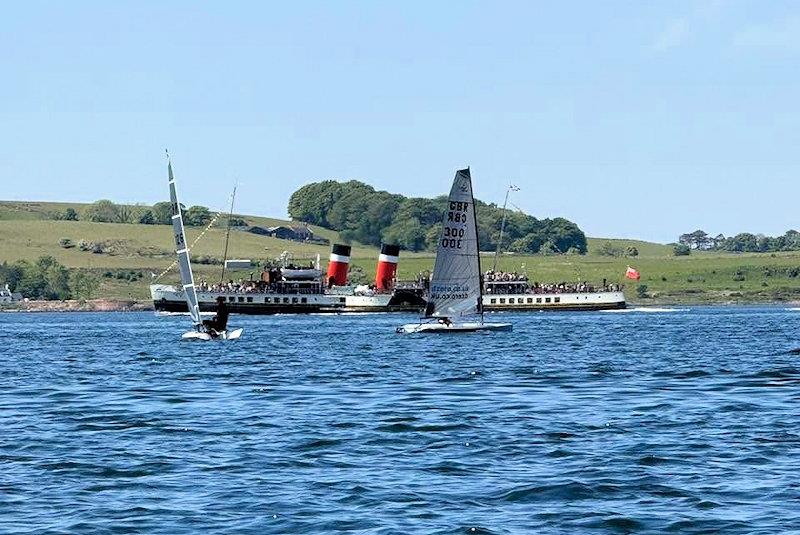 Finley Briggs races against Niel Ritchie in front of the 'Waverley' - D-Zeros at the Largs Chandlers Harken One Design Regatta photo copyright Finn McDermott taken at Largs Sailing Club and featuring the D-Zero class