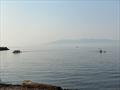 Outrigger canoes and other marine traffic ply the waters of Bellingham Bay during a 'low-smoke day' in mid-October; the `fog` in the background used to be trees © David Schmidt