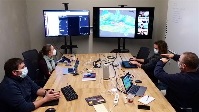Virtual planning sessions for AUV Sentry at WHOI's David Center. WHOI geochemist Chris German (far right, gesturing) helped organize these sessions, also pictured (clockwise) Jessica Roland and Matt Silvia - photo © Ken Kostel / Woods Hole Oceanographic Institution