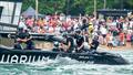 New Zealand SailGP crew celebrate as they cross the finish line to win the final race on Race Day 2 of the Singapore Sail Grand Prix  © Bob Martin/SailGP