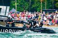 New Zealand SailGP crew celebrate as they cross the finish line to win the final race on Race Day 2 of the Singapore Sail Grand Prix  © Bob Martin/SailGP