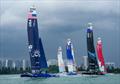 USA, New Zealand SailGP Team and Canada SailGP Team during a practice session with the city in the background ahead of the Singapore Sail Grand Prix  © Bob Martin/SailGP