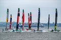 11 of the 12 teams at full chat heading for Mark 1 - Day 2 of the Mubadala New York Sail Grand Prix  © Jason Ludlow /SailGP