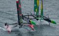 Switzerland SailGP Team helmed by Sebastien Schneiter alongside BONDS Flying Roos SailGP Team helmed by Tom Slingsby as they compete in the event final on Race Day 2 of the Rolex Switzerland Sail Grand Prix held in Geneva © Samo Vidic for SailGP