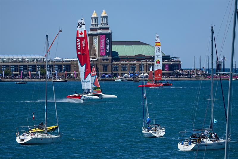 Canada SailGP Team and Spain SailGP Team sail past the Navy Pier and spectator boats on Race Day 1 of the T-Mobile United States Sail Grand Prix | Chicago at Navy Pier, Lake Michigan, Season 3 photo copyright Jon Buckle/SailGP taken at Chicago Yacht Club and featuring the F50 class