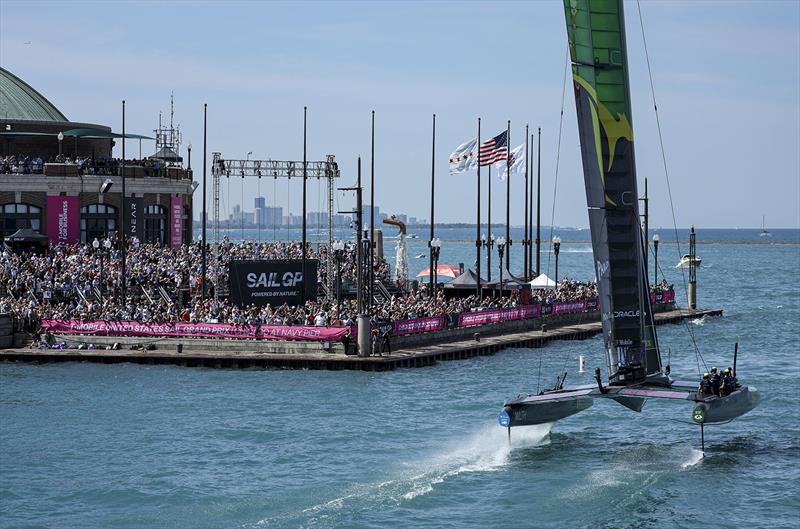 Australia SailGP Team helmed by Tom Slingsby celebrate winning by sailing by spectators on Navy Pier on Race Day 2 of the T-Mobile United States Sail Grand Prix | Chicago at Navy Pier, Lake Michigan, Season 3, in Chicago, Illinois, USA. 19th June 2022. - photo © Simon Bruty for SailGP