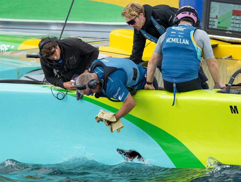 SailGP tech team repair a hole in the hull of the Mubadala Brazil SailGP Team F50 catamaran on the water, ahead of racing on Race Day 2 of the Rolex Switzerland Sail Grand Prix held in Geneva - photo © Ricardo Pinto for SailGP