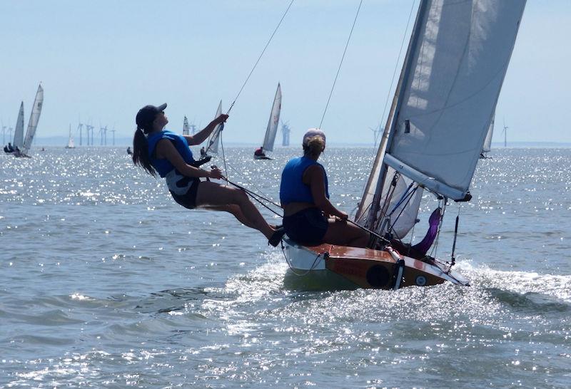 Lilli Bell trapezing in the sunshine, out on the Fireball's wire, heading out in the Fast handicap race during Kippford Week 2022 photo copyright Becky Davison taken at Solway Yacht Club and featuring the Fireball class