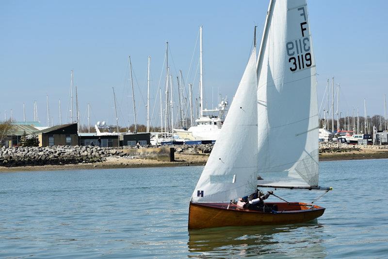 Still ghosting along in the lightest of breezes, the glorious varnished finish, the Hamble River and the old Fairey Marine works as a backdrop photo copyright Dougal Henshall taken at Hamble River Sailing Club and featuring the Firefly class