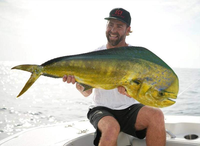 Fisherman Ben Glass holding mahi mahi caught at Sunshine Coast FAD - photo © Creek to Coast