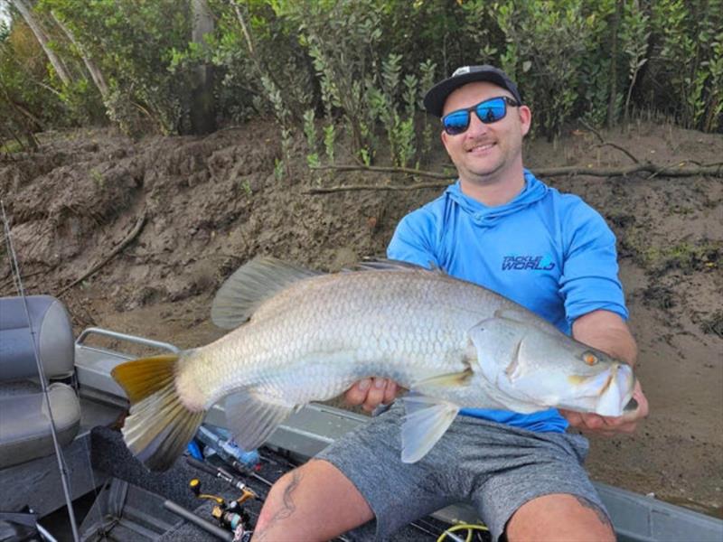 Jacko is pleased as punch with his first salty barra - photo © Fisho's Tackle World