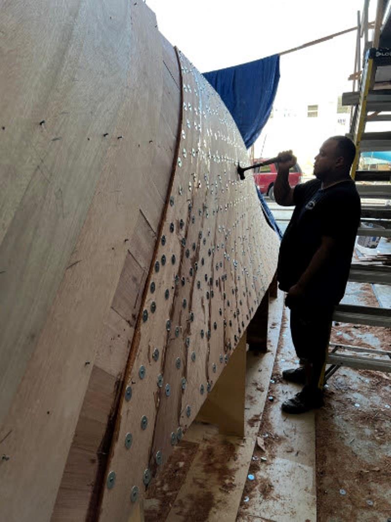Hull #10 - David gluing hullside planking photo copyright Michael Rybovich & Sons taken at  and featuring the Fishing boat class