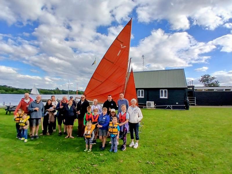 A group of Gull sailors gather around the first Gull Dinghy, owned by Roger Proctor and designed by his father, Ian Proctor in 1956 photo copyright Jenny Riley taken at Norfolk Broads Yacht Club and featuring the Gull class