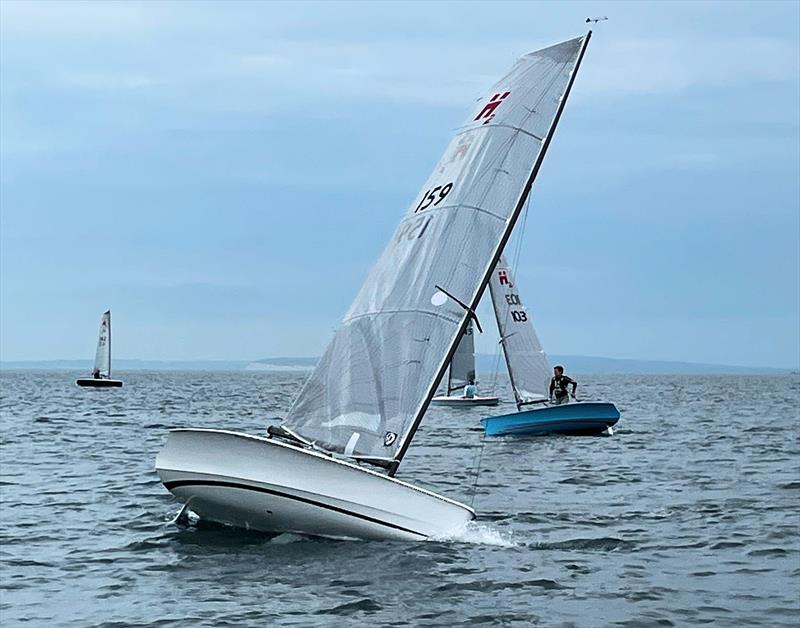 Josh Hamer roll tacks on day 2 of the Hadron H2 Nationals photo copyright Sarah Press taken at Highcliffe Sailing Club and featuring the Hadron H2 class