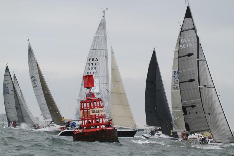 Fleet bears away round Weststroombank - Half Ton Classics Cup 2018 - Day 4 photo copyright www.fionabrown.com taken at Koninklijke Yachtclub Nieuwpoort and featuring the Half Tonner class