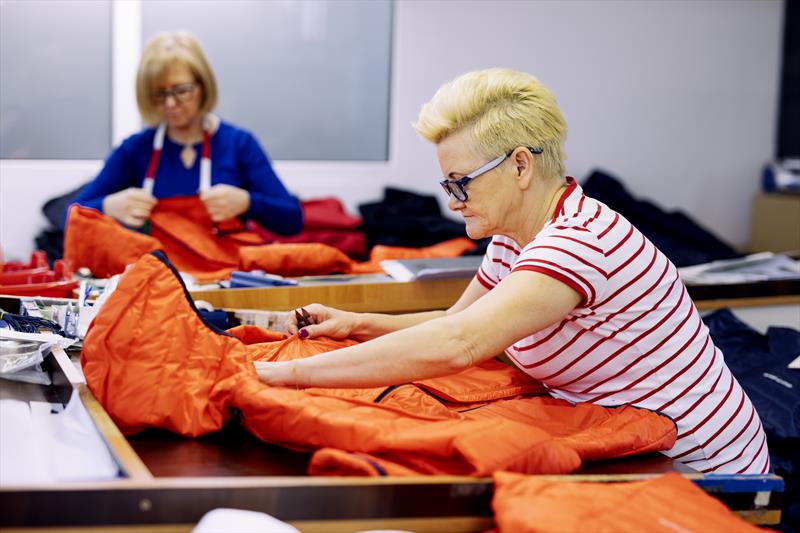 Working on the Mav HL Liner Hood Jacket at the Henri-Lloyd factory in Poland photo copyright Henri-Lloyd taken at  and featuring the  class