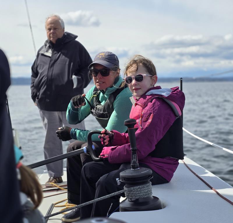 Claire (age 8) joins Cascadia Sailing for an day of keelboat sailing, where she enjoys some pro driving tips from Jen Glass, the team's tactician - photo © Image courtesy of Cascadia Sailing Collection