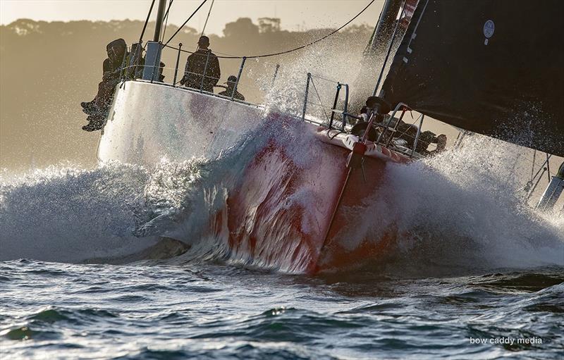 andoo Comanche punches out through Sydney Heads - photo © Bow Caddy Media