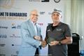 Professor Graeme Nimmo RFD presenting Allan Larkin from Noire with one of their trophies &copy; @sailorgirlhq