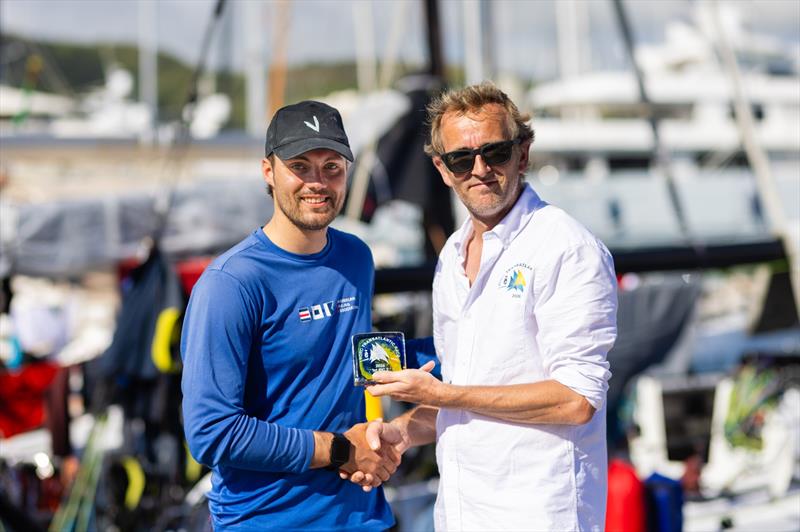 Sam Hall receives the IRC Two winners' prize from RORC Transatlantic Race Director Chris Jackson - photo © Arthur Daniel / RORC