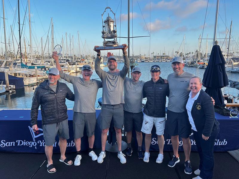 2026 Islands Race - Rogers 46 Natural Nine team hoisting the overall Islands Race 1st place trophy - photo © Bruce Crary / Bronny Daniels