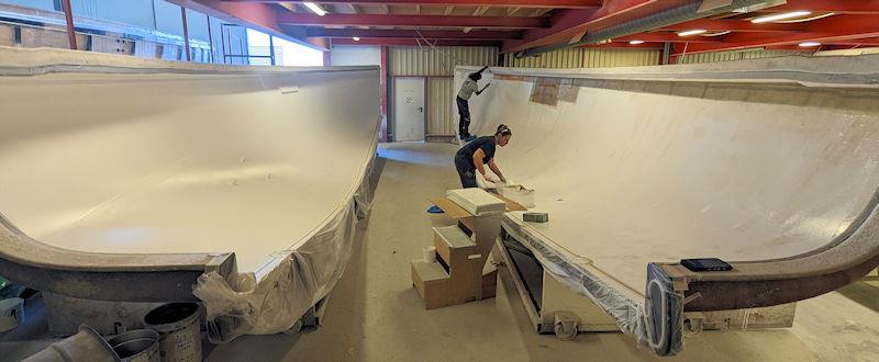 Lamination on the J/112E hull while the mould is in two parts - photo © Mark Jardine