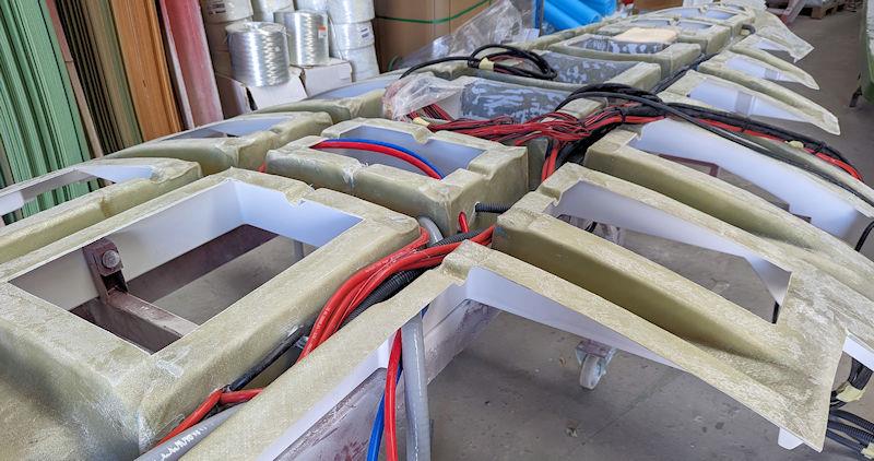 The grid upside-down with the wiring loom being installed - photo © Mark Jardine