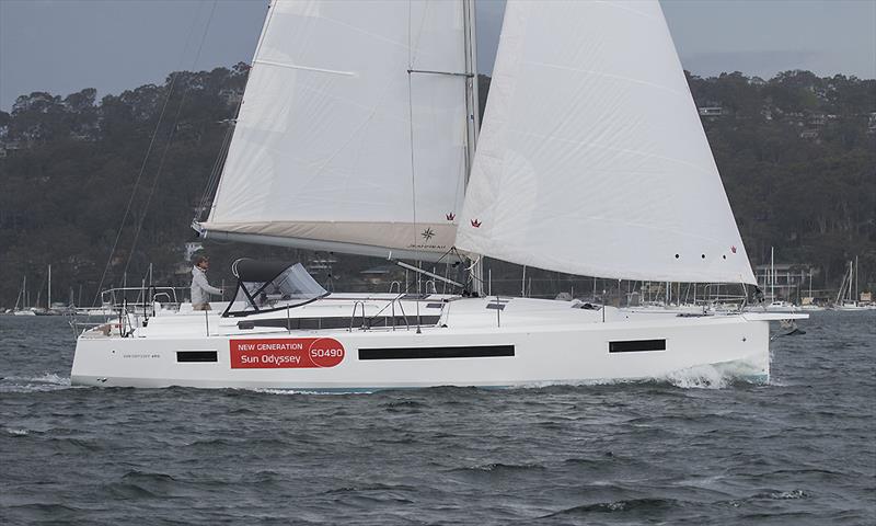 In profile, whether sails up or sails down, she is very appealing - note here the swept back spreaders and the Open 60-esque boom angle with the gooseneck very low - Jeanneau Sun Odyssey 490 - photo © John Curnow