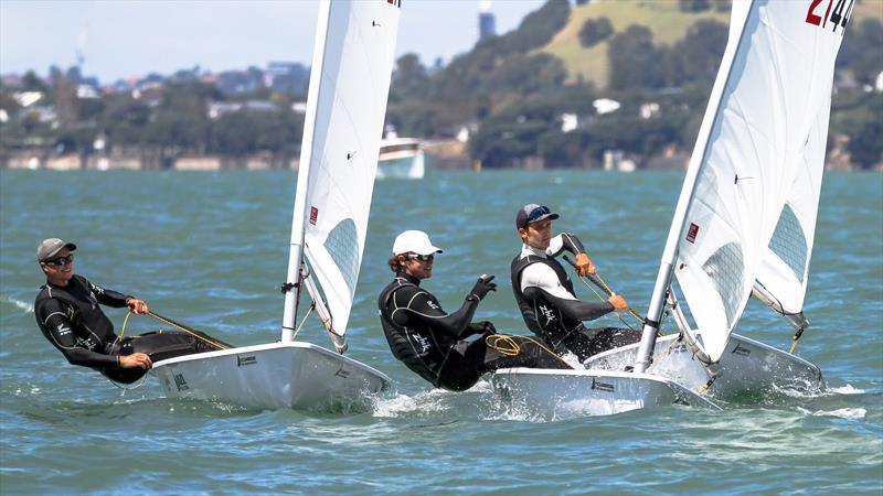 A pre-mark rounding discussion - from left Luke Cashmore, George Gautrey and Tom Saunders - ILCA7 - Oceanbridge NZL Sailing Regatta - Takapuna BC - February 18, photo copyright Richard Gladwell - Sail-World.com/nz taken at Takapuna Boating Club and featuring the ILCA 7 class