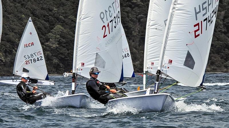 Greta Pilkington (217319 - 4th overall in the Open ILCA 6 fleet) chases Dylan Forsyth (217424) 3rd overall in the ILCA6 Open fleet, giving credibility to the standard of the ILCA 6 Womens Squad photo copyright Christel Hopkins taken at Queen Charlotte Yacht Club and featuring the ILCA 6 class