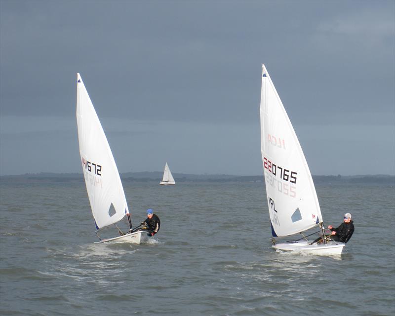 ILCA 6 finish with D Peelo and H Dunne on Howth YC Dinghy Frostbites Spring Series Day 4 - photo © Neil Murphy
