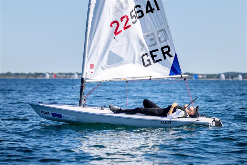 The calm off the coast of Kiel prevented races in several classes from taking place. The ILCA 4 and 6 Open classes had even set sail but their only try was abandoned and boats were forced to return - photo © Christian Beeck / Kieler Woche 2026