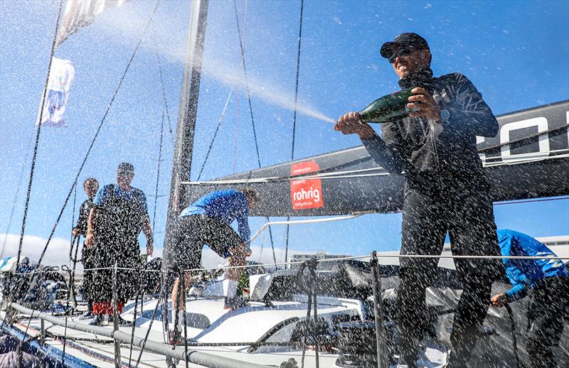 Mark Bradford sprays the champagne onto Wild Oats XI photo copyright Crosbie Lorimer taken at Cruising Yacht Club of Australia and featuring the Maxi class