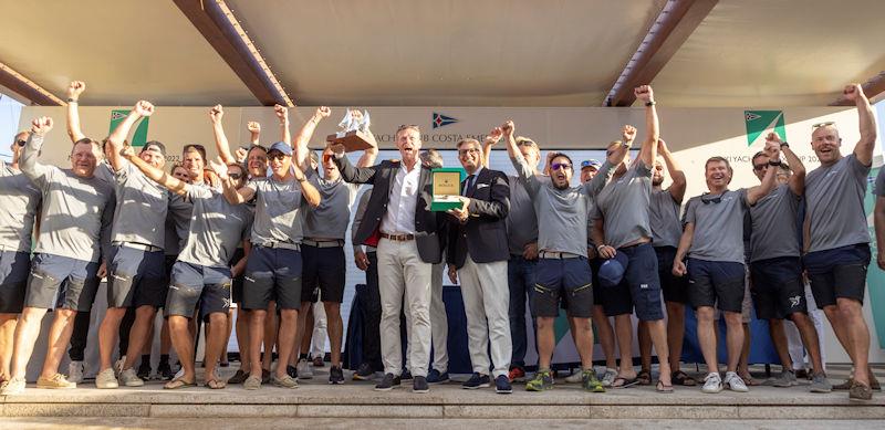 The crew of Shamanna collect their prizes for winning the Super Maxi class at the Maxi Yacht Rolex Cup 2022 photo copyright IMA / Studio Borlenghi taken at Yacht Club Costa Smeralda and featuring the Maxi class